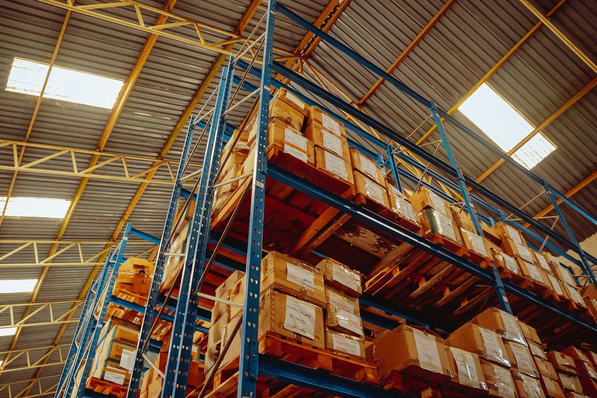 Warehouse shelving stocked with boxed products